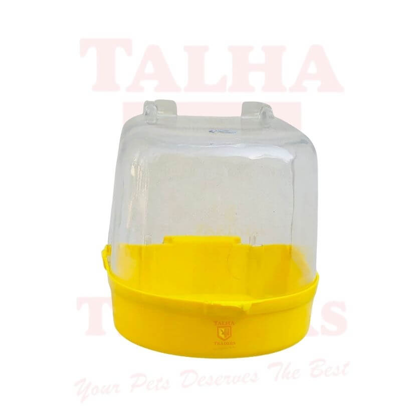 Clear plastic bird bat tub with yellow base on a white background.