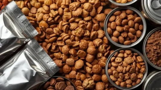 Assorted Cat & Dog food packages and cans on a wooden surface