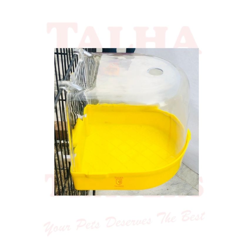 Yellow pet cage with a transparent top on a white background