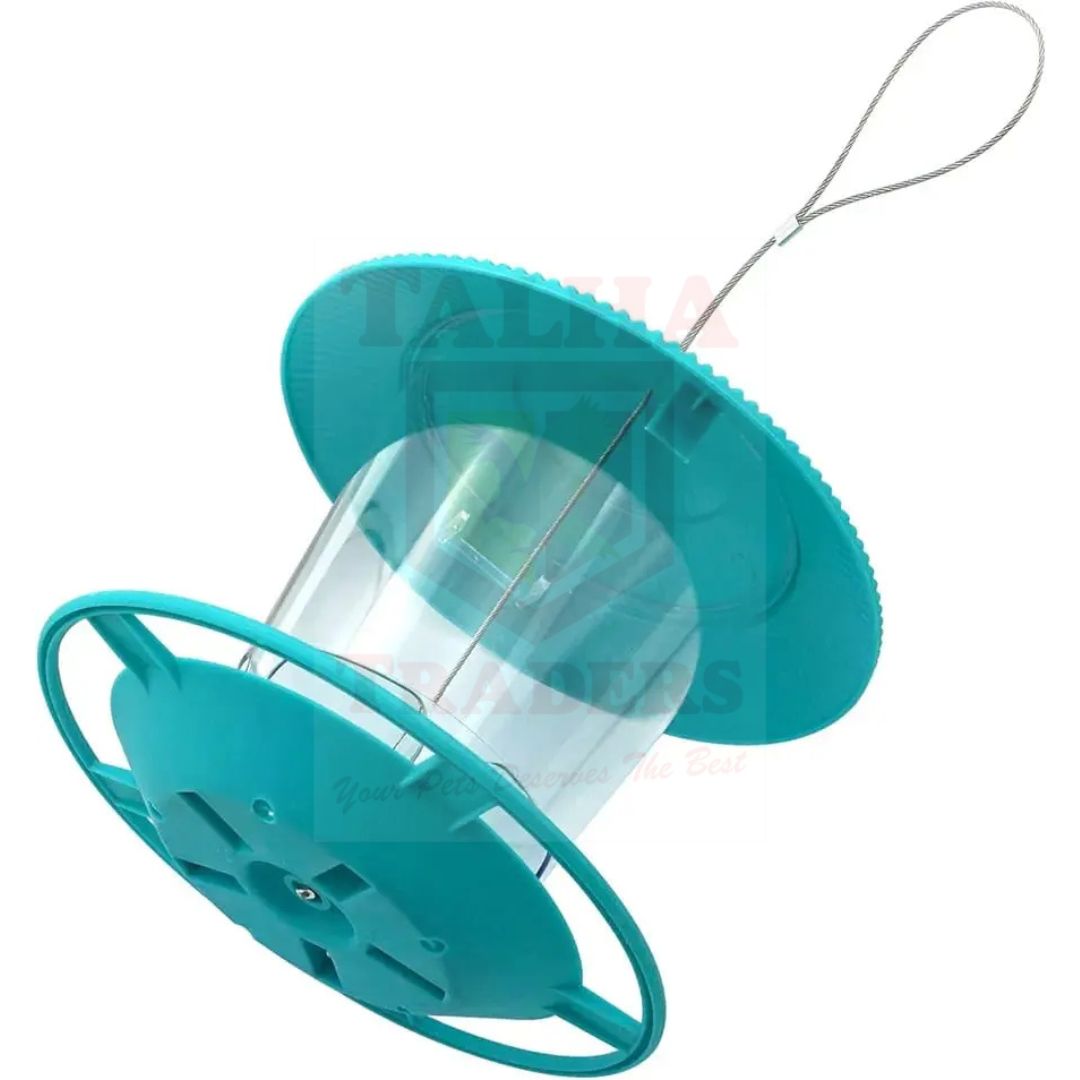 green bird hanging feeder in tilt position on a white background